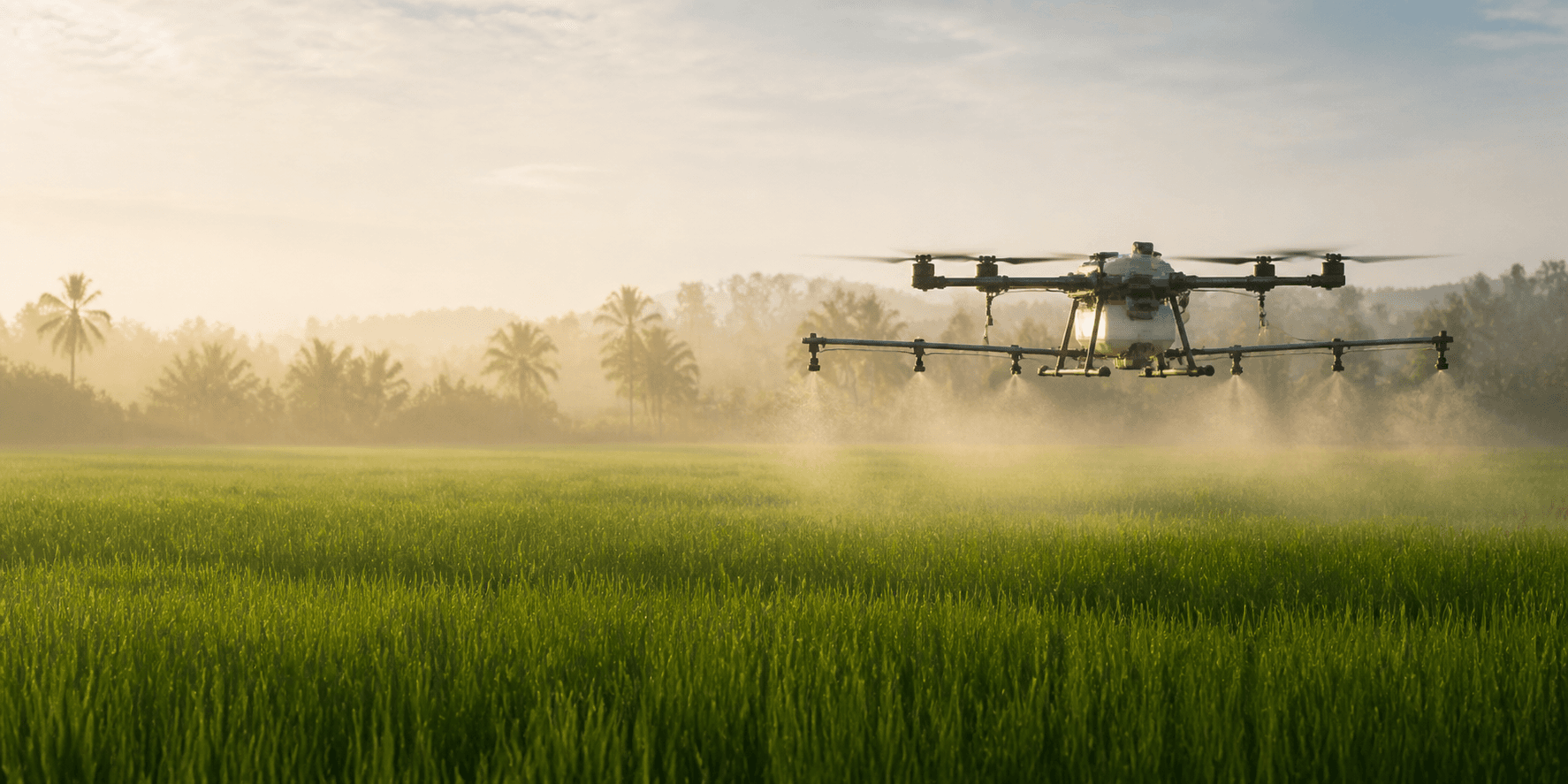 Agricultural spraying drone operating above a green field